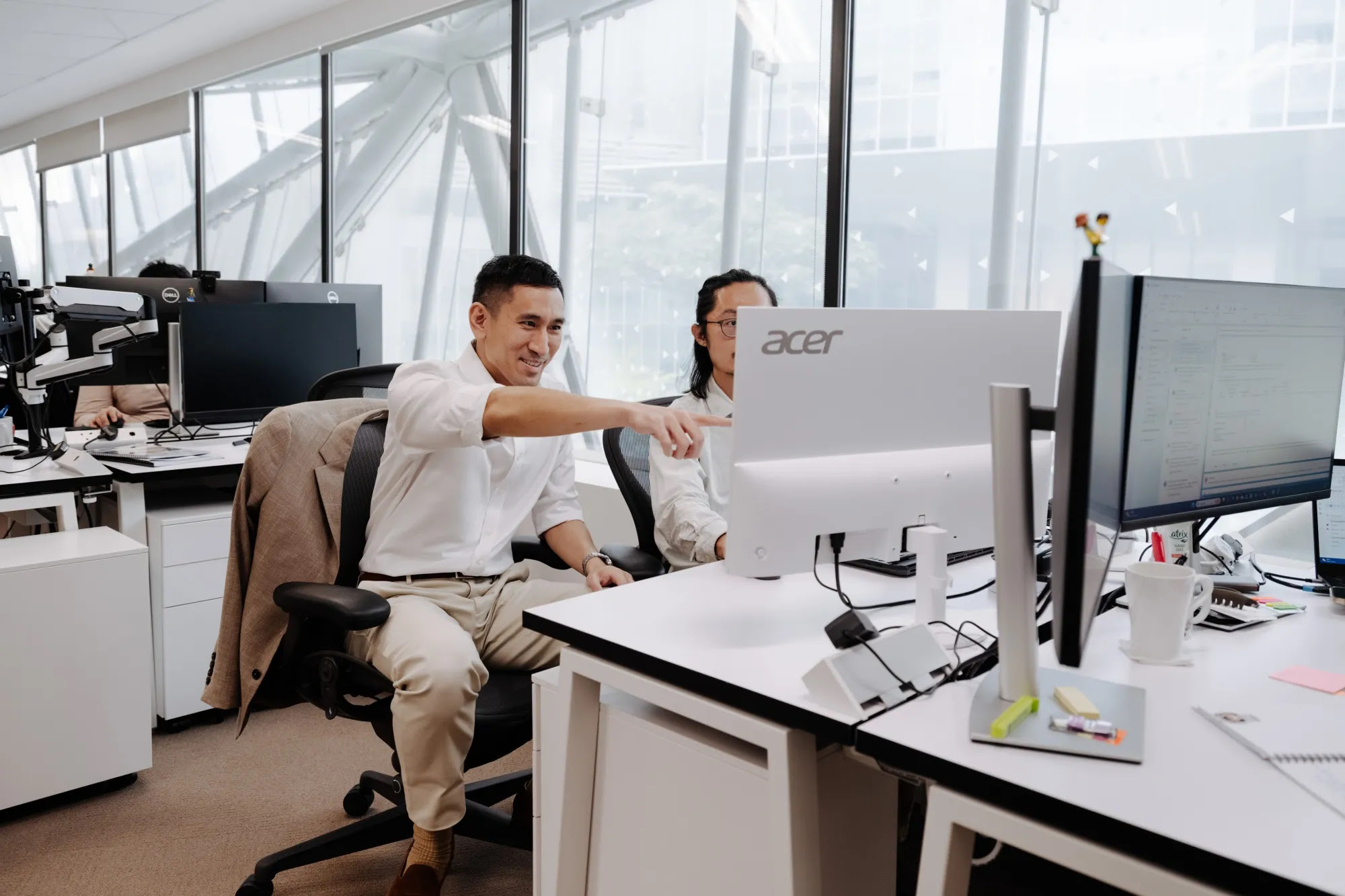 Chiu and a trader at the SilverCape office
